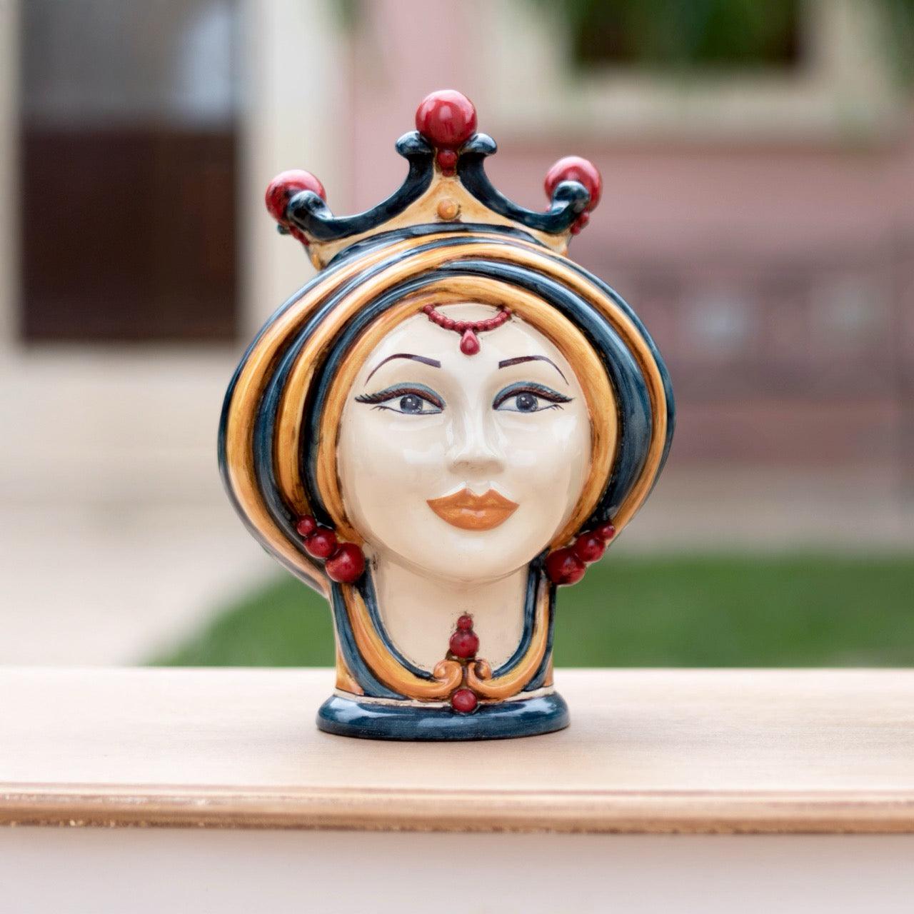 Handmade ceramic Testa di Moro woman head in blue and orange with crown, outdoor display