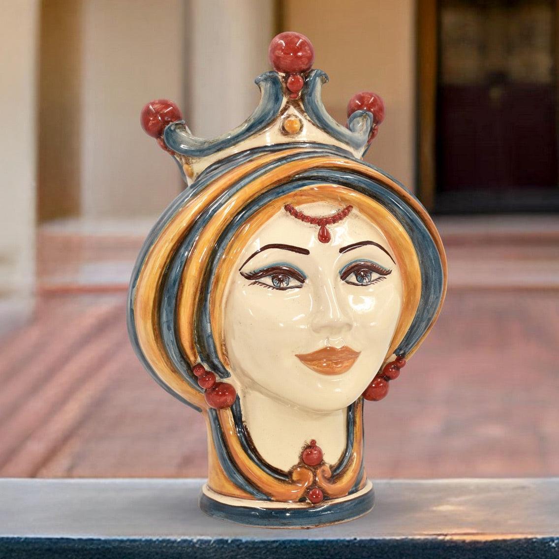 Handcrafted Caltagirone ceramic female head vase in blue and orange with crown detail