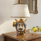 Handmade Sicilian Testa di Moro table lamp with crown, mustache, and citrus details, blending tradition and modern design.