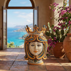 Handmade Teste di Moro ceramic vase with crown, set on terrace with sea view and bougainvillea