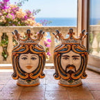 Handmade Teste di Moro ceramic vases with crowned faces, perfect for Mediterranean home decor