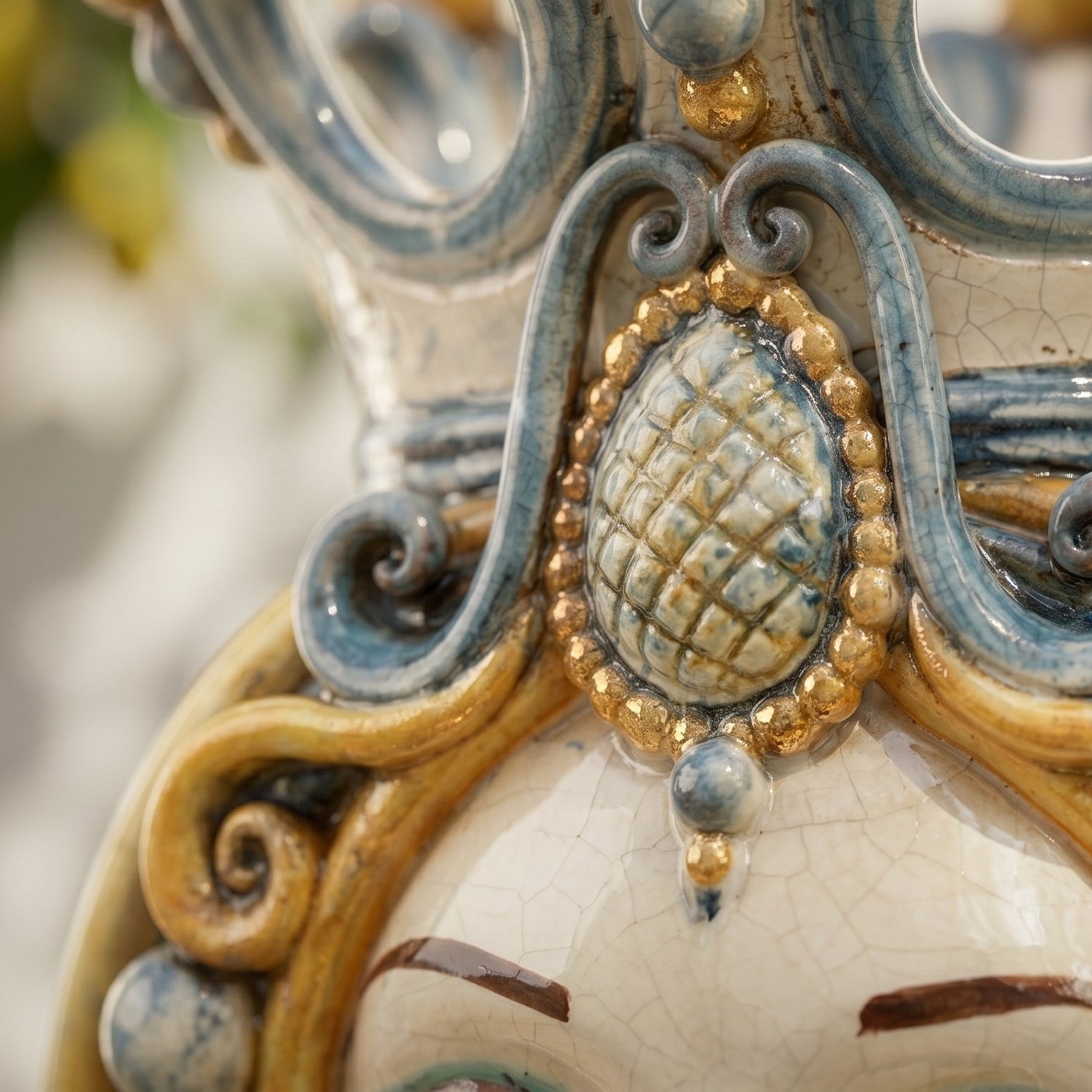 Handcrafted Teste di Moro ceramic with intricate blue and gold scrollwork and crackle glaze detail