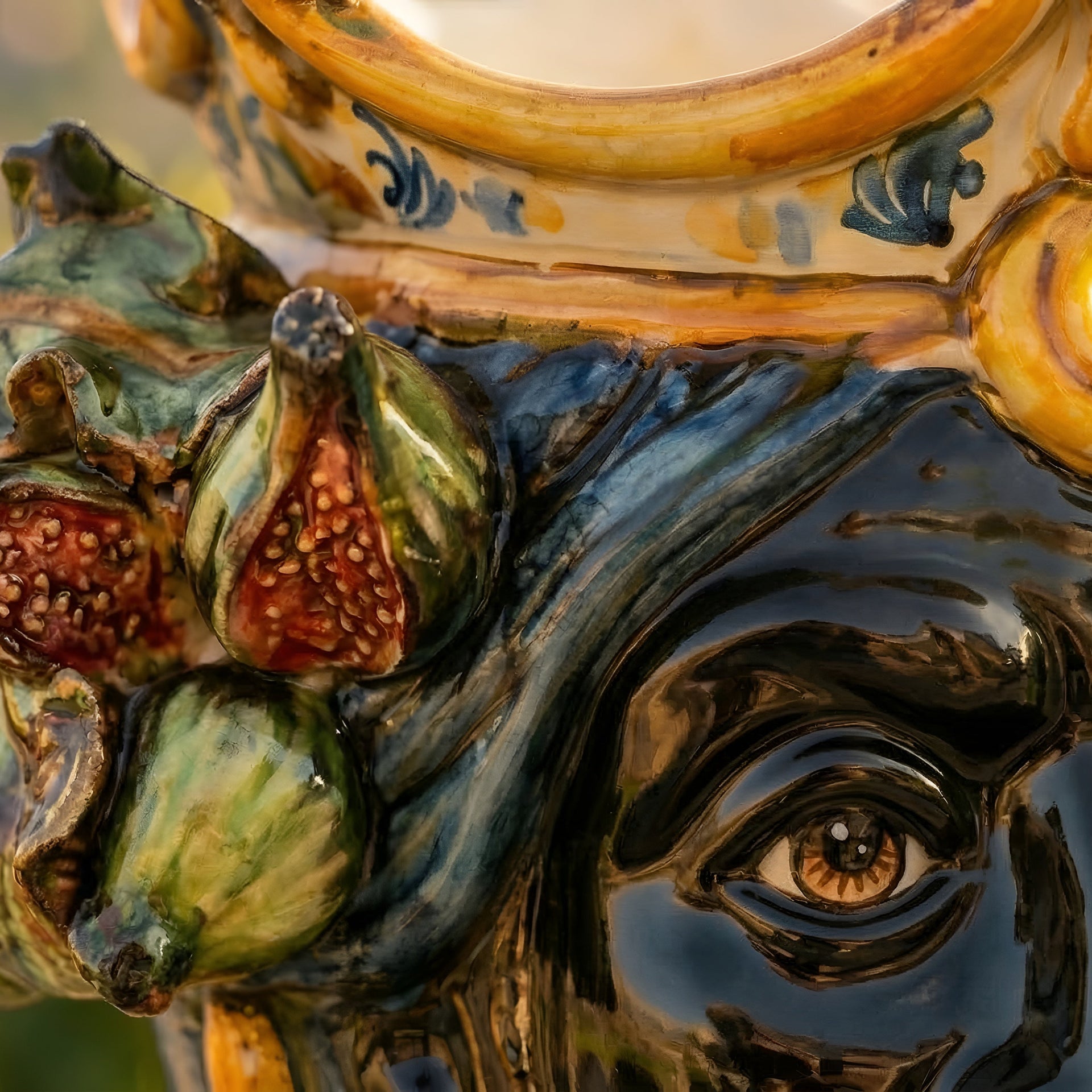 Handcrafted Teste di Moro ceramic with figs, glazed details, and expressive eye, blending tradition and modern design.