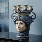 Handmade Teste di Moro ceramic vase with blue hair, crown, and candle holders, blending tradition and modern design.