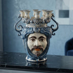 Handmade Teste di Moro ceramic vase with blue and white glaze, featuring a bearded face and crown with candle holders