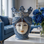 Handmade blue and white Teste di Moro vase with crown, styled in modern living room with peonies