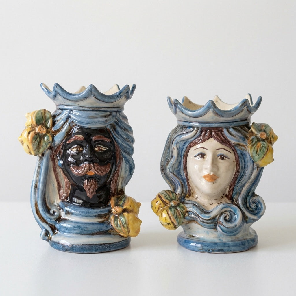 Handmade Teste di Moro ceramic vases with blue glaze, floral accents, and expressive faces for home decor