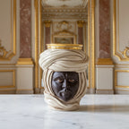 Handmade Teste di Moro vase with turban, gold rim, on marble table in luxury interior