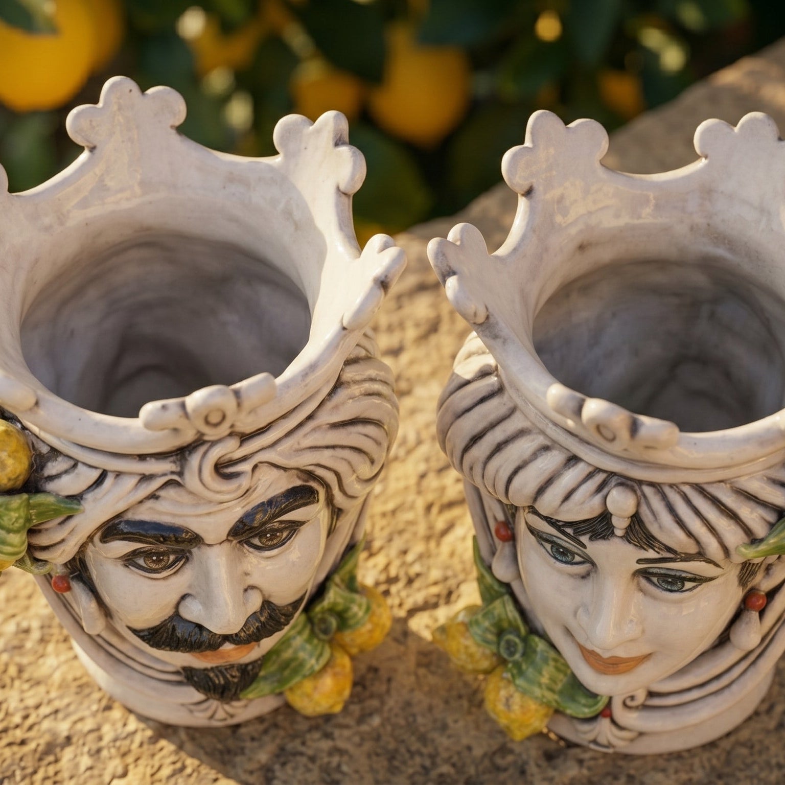 Handcrafted Teste di Moro ceramic vases with crowned faces, lemon accents, and traditional Sicilian design