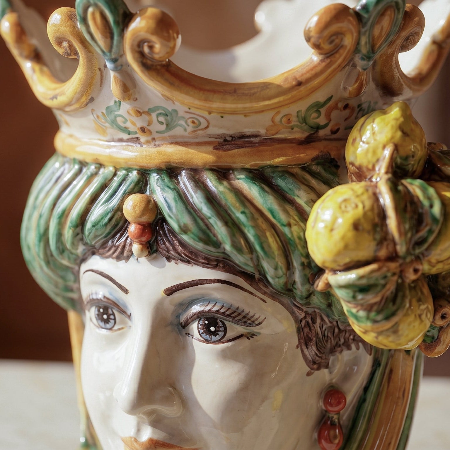 Handcrafted Teste di Moro ceramic vase with colorful crown, green hair, and lemon accents, blending tradition and modern design.