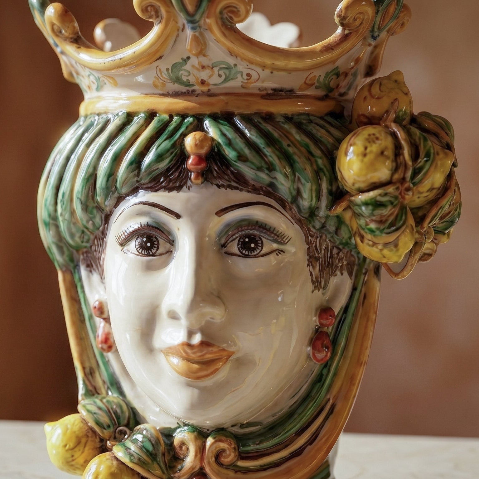 Handcrafted Teste di Moro ceramic vase with vibrant green, yellow, and red details, featuring a crowned face and lemon accents.