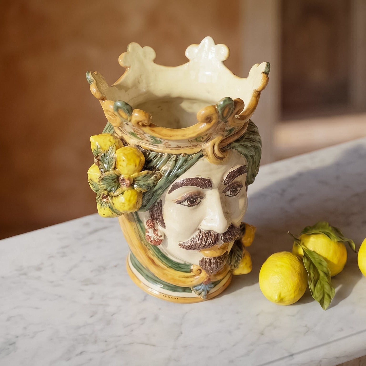 Handcrafted Teste di Moro vase with crown, lemons, and green leaves, blending tradition and modern design.
