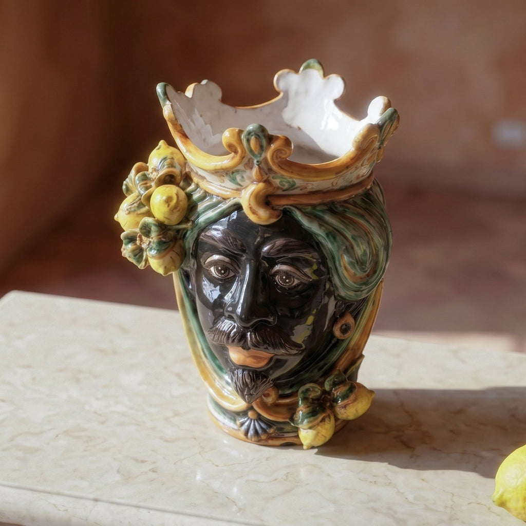Handmade Teste di Moro ceramic vase with crown, lemons, and green swirls, blending tradition and modern design.
