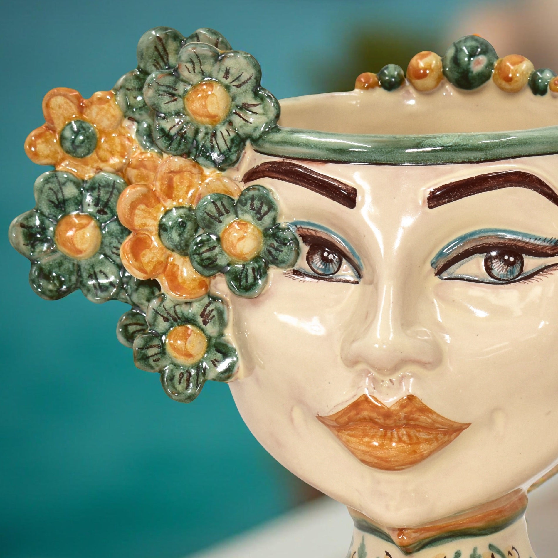 Handcrafted ceramic Testa di Moro vase with floral decorations and detailed face