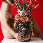Handcrafted Teste di Moro vase with floral crown, vibrant colors, and olive branches, blending tradition and modern design.