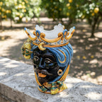 Handcrafted Teste di Moro vase with blue turban, crown, and lemon accents, showcasing Sicilian ceramic art.