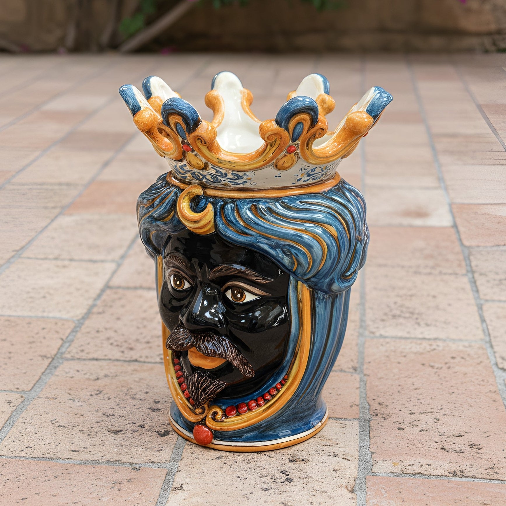 Handcrafted Teste di Moro ceramic vase with crown, blue swirls, and vibrant details for modern decor