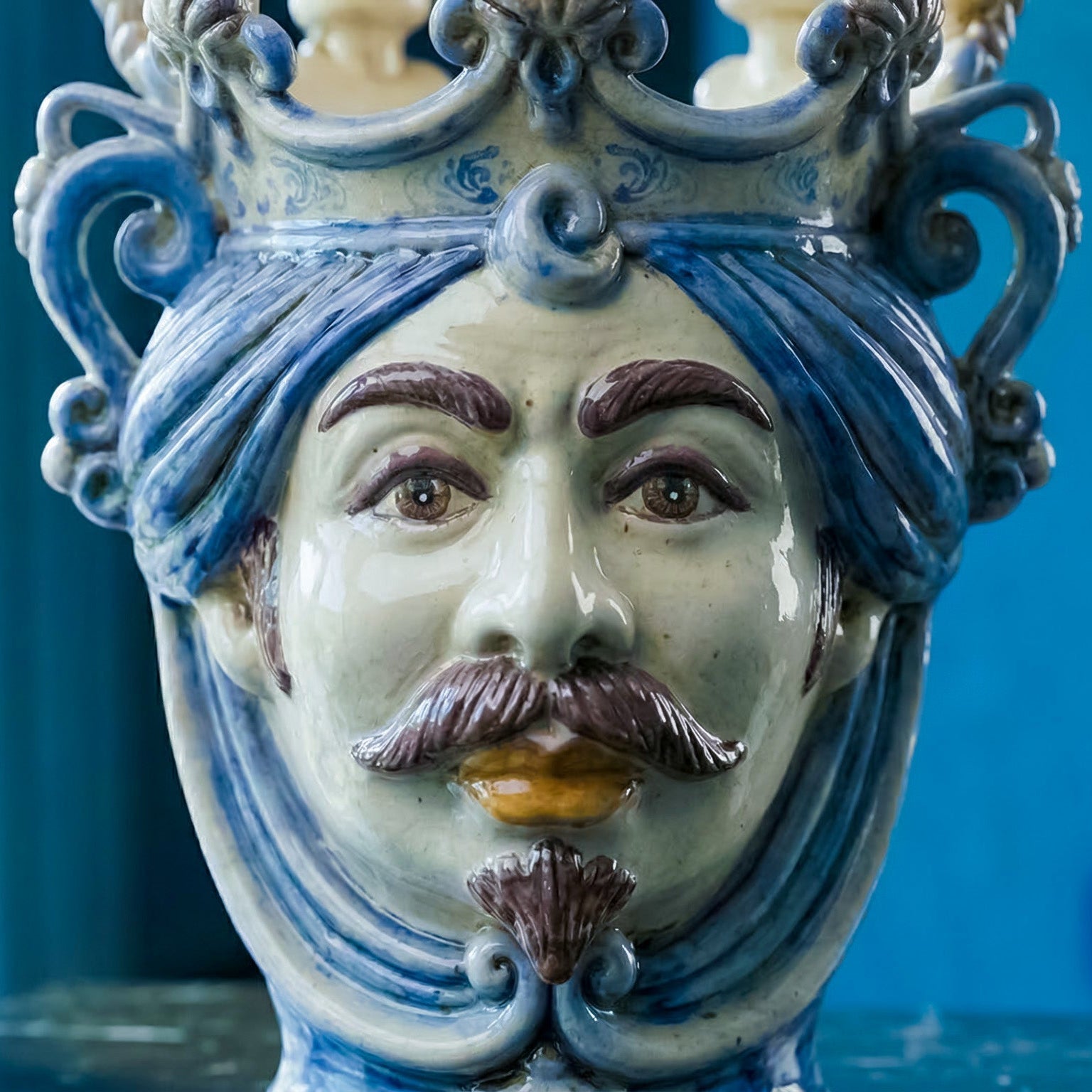 Handcrafted Teste di Moro ceramic vase with blue turban, mustache, and ornate crown details.