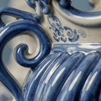 Close-up of a handcrafted Teste di Moro ceramic with blue swirls and intricate patterns, blending tradition and modern design.