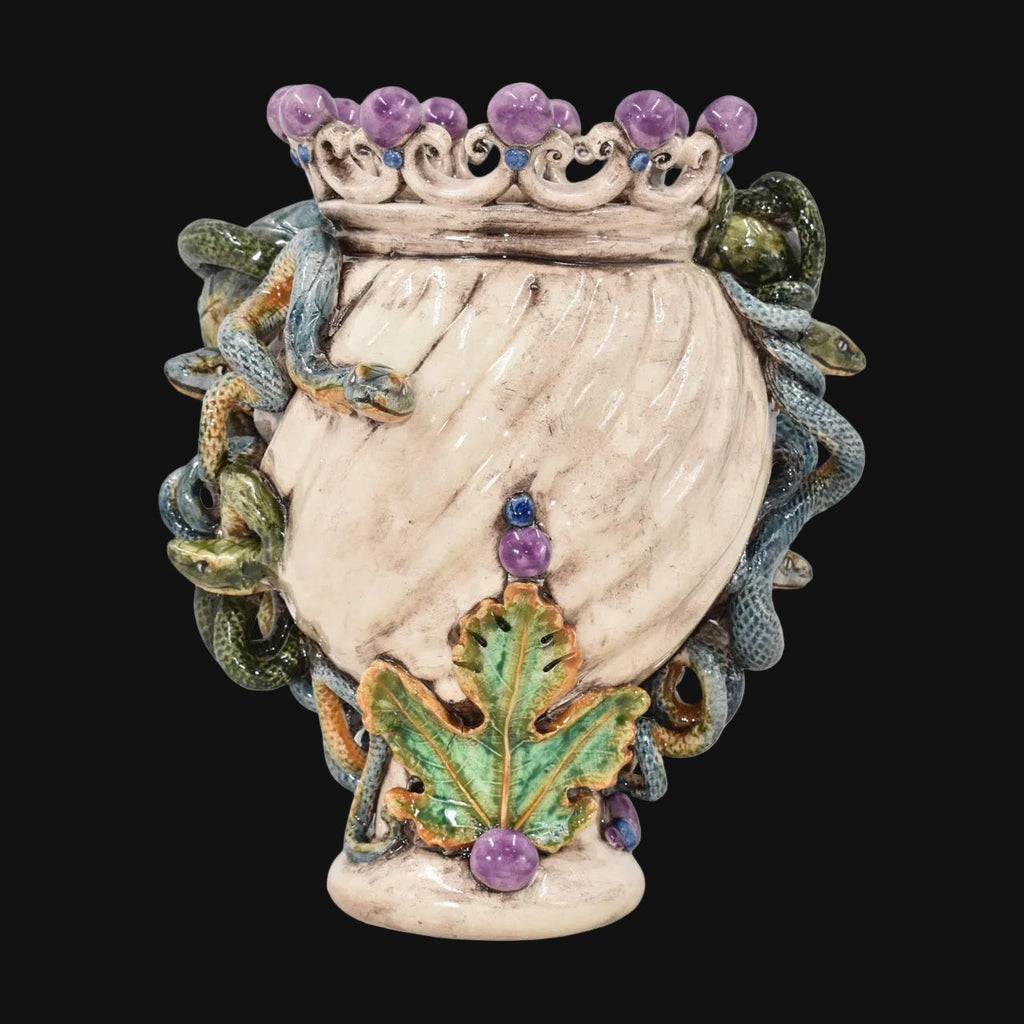 Handcrafted Teste di Moro vase with snakes, purple gems, and leaf details, blending tradition and modern design.