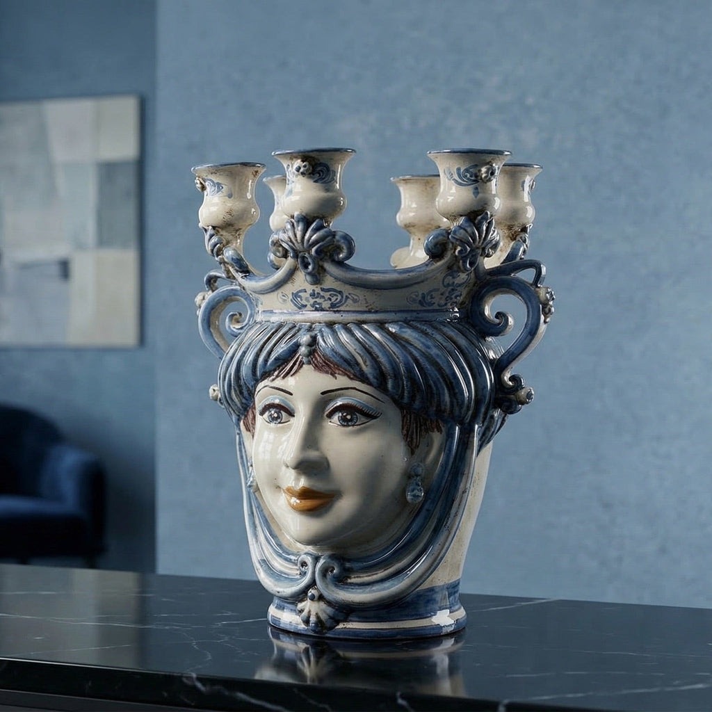 Handmade ceramic Teste di Moro vase with blue and white design, featuring a woman's face and candle holders.