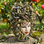 Handcrafted Medusa head sculpture with snake hair, perfect for garden or home decor