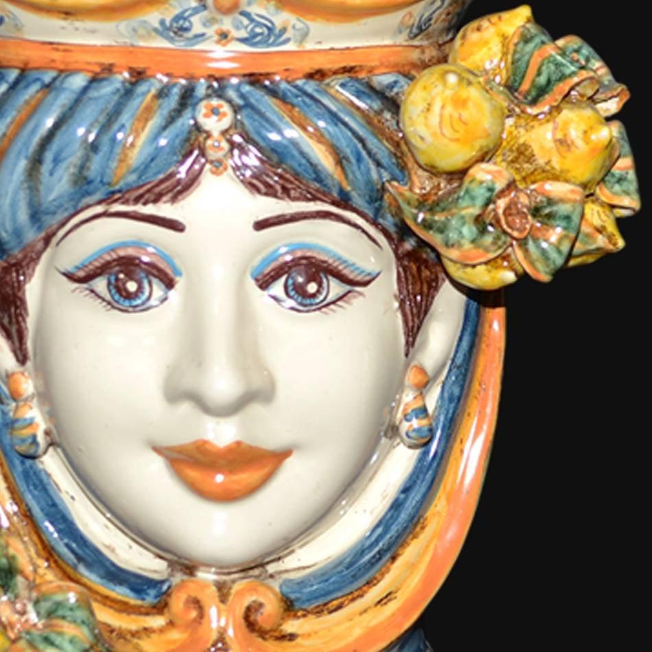 Handcrafted Sicilian female ceramic head vase with blue and orange details and fruit accents