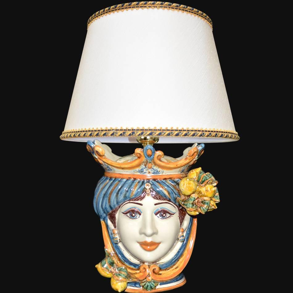 Handcrafted Teste di Moro table lamp with colorful ceramic face, blue hair, and lemon accents under white shade