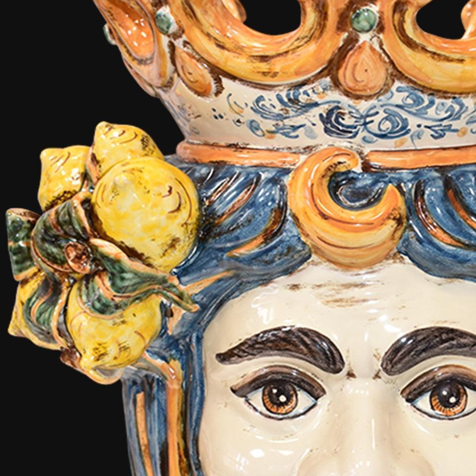Handmade Sicilian Teste di Moro with vibrant blue hair, lemon accents, and ornate crown detail