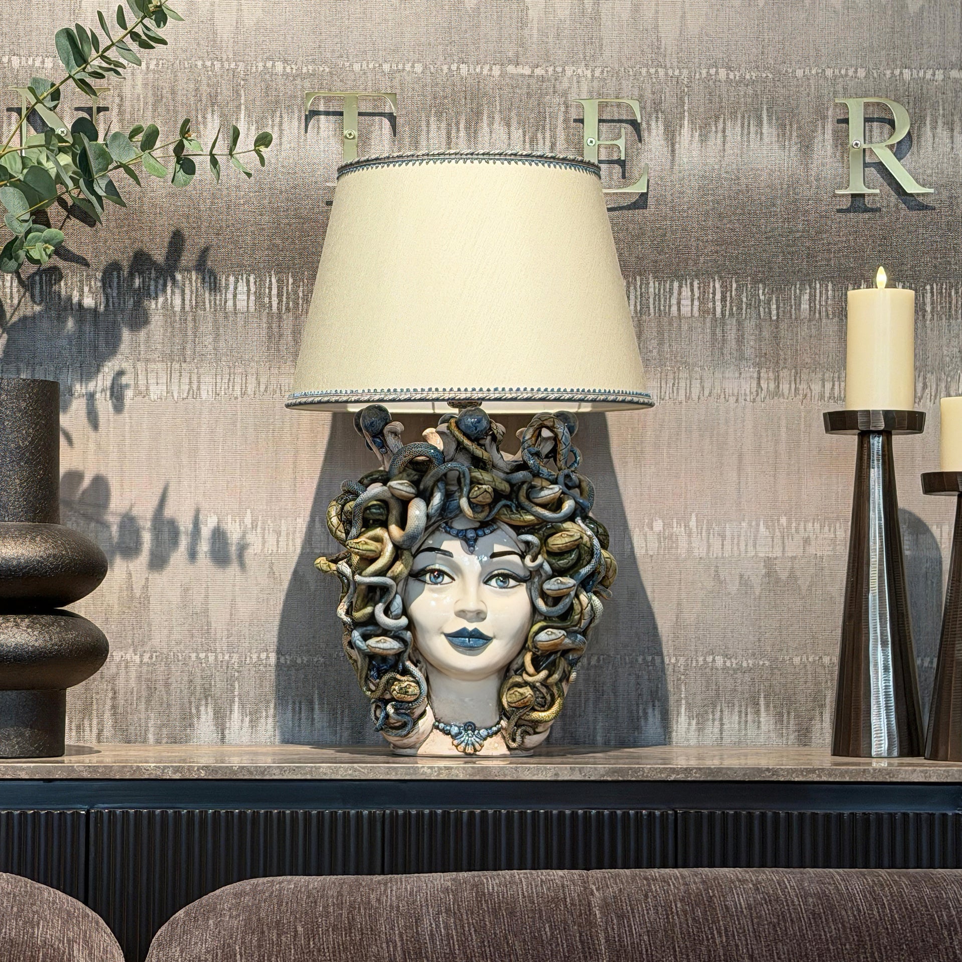 Handcrafted Medusa head table lamp with snake details, blending tradition and modern design for home decor.
