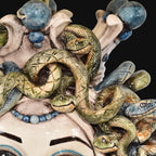 Handcrafted Teste di Moro ceramic with coiled snakes and blue beads, blending tradition and modern design.