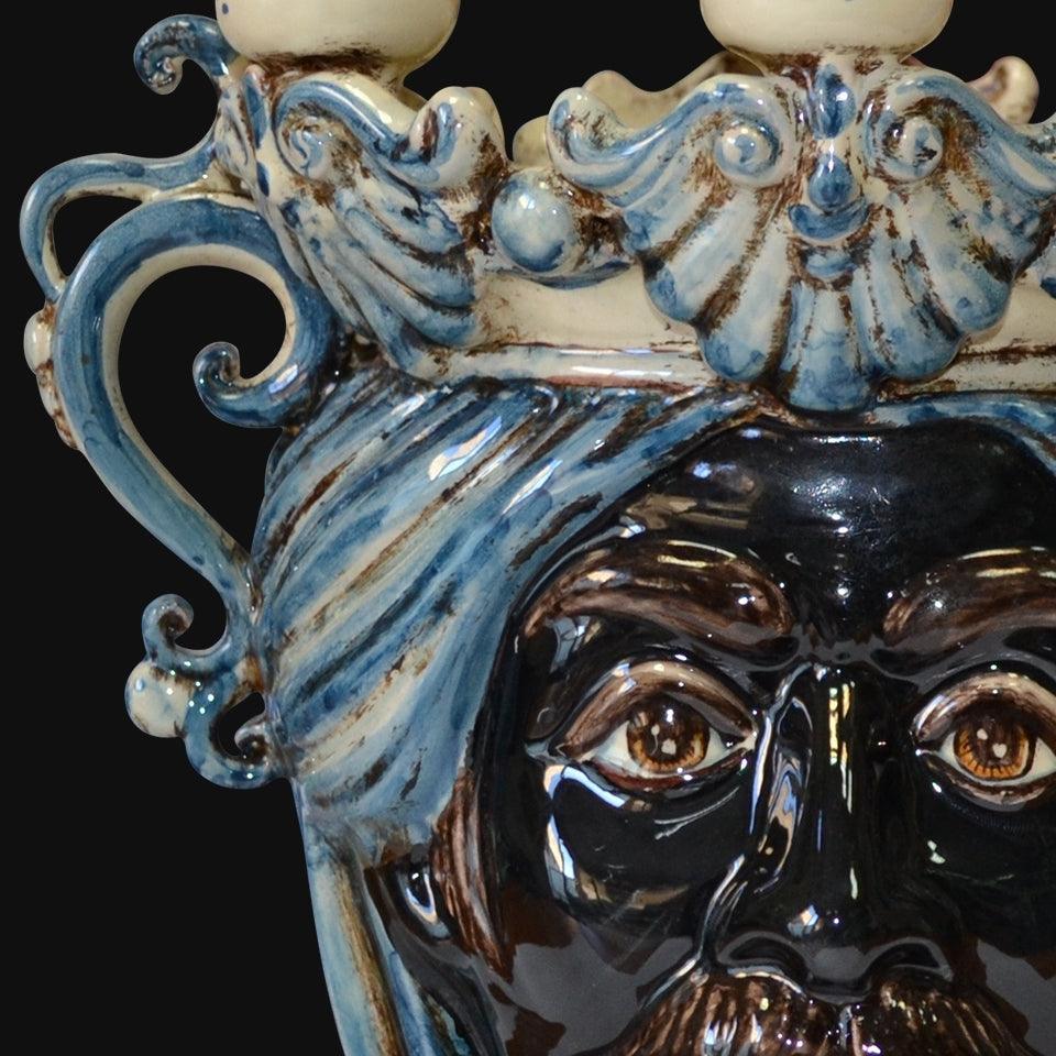 Handcrafted Teste di Moro ceramic with blue swirls and expressive eyes, blending tradition and modern design.