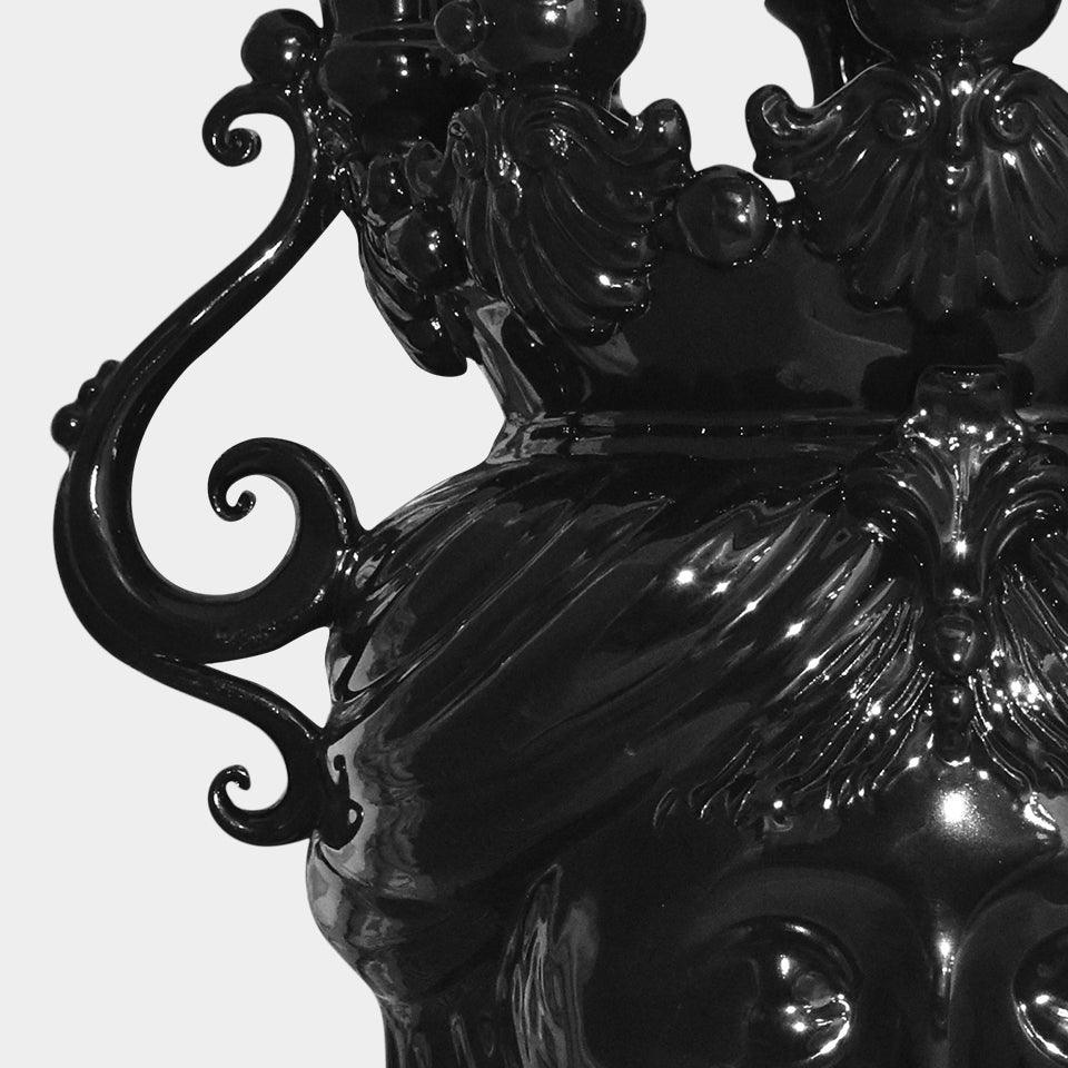 Glossy black Testa di Moro sculpture with ornate scrollwork and detailed craftsmanship