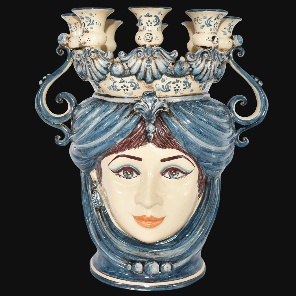 Handmade Teste di Moro ceramic vase with blue and white face design, ornate crown, and candle holders