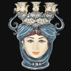 Handmade Teste di Moro ceramic vase with blue and white face design, ornate crown, and candle holders