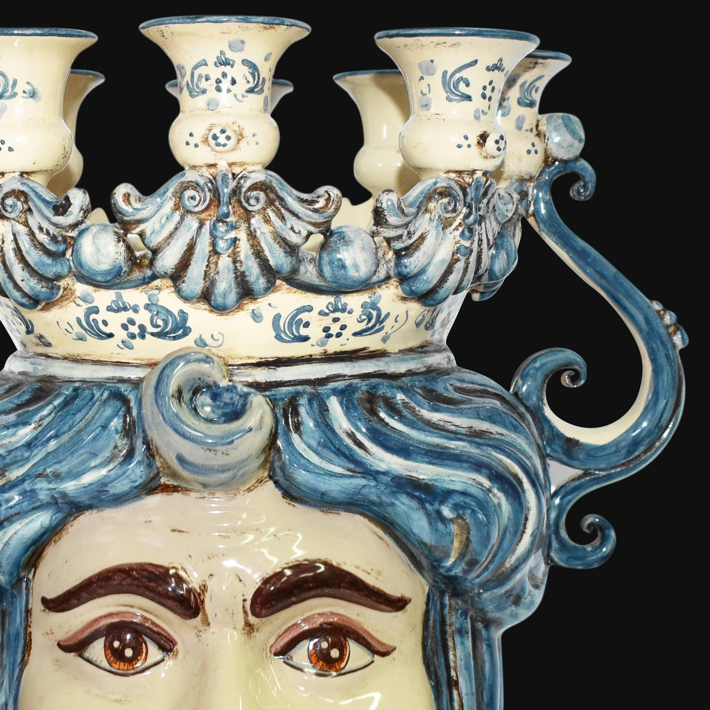Handcrafted Teste di Moro candelabra with blue swirls and detailed facial features, blending tradition and modern design.