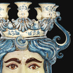 Handcrafted Teste di Moro candelabra with blue swirls and detailed facial features, blending tradition and modern design.