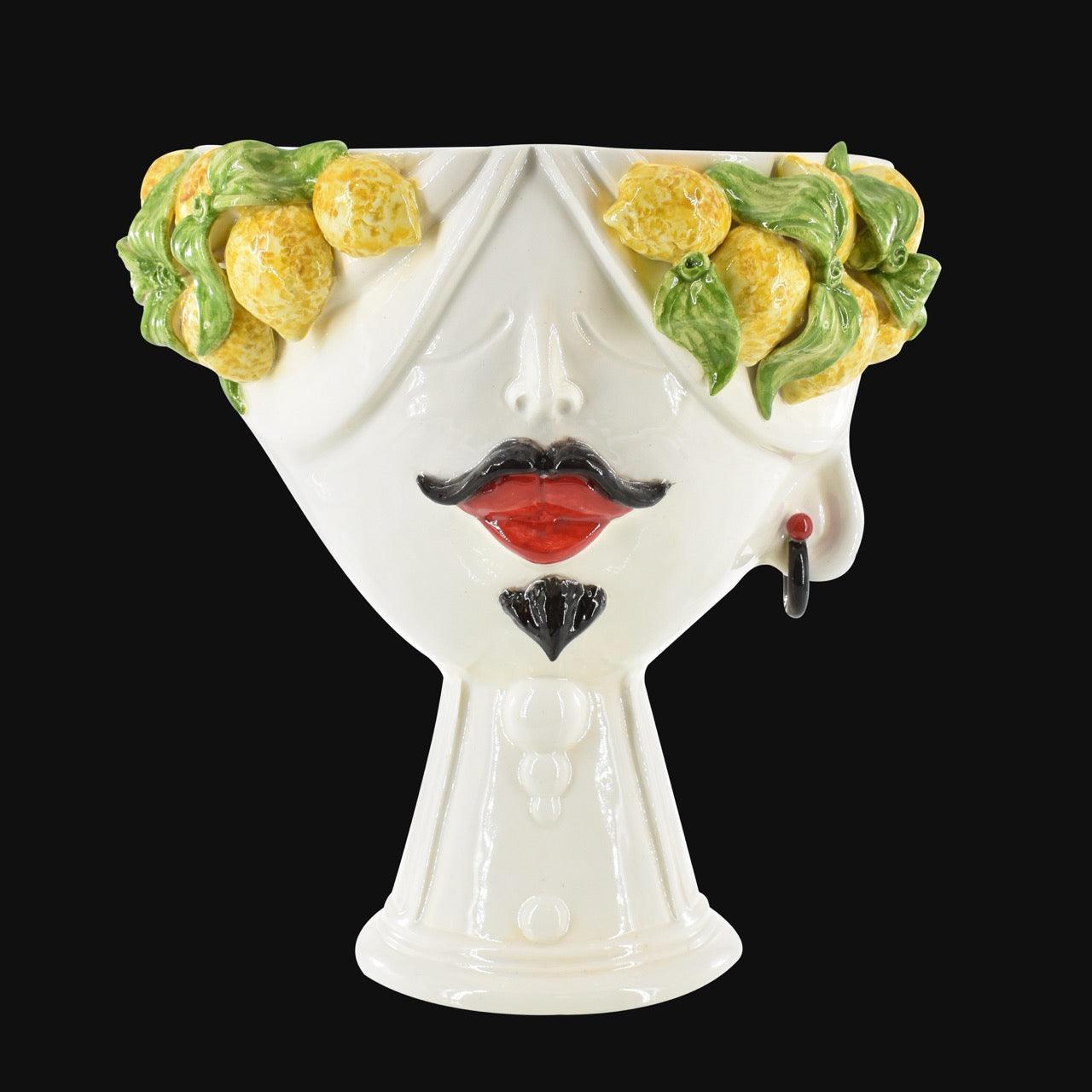 Handcrafted Teste di Moro vase with lemon garland, bold red lips, and black mustache, blending tradition and modern design.