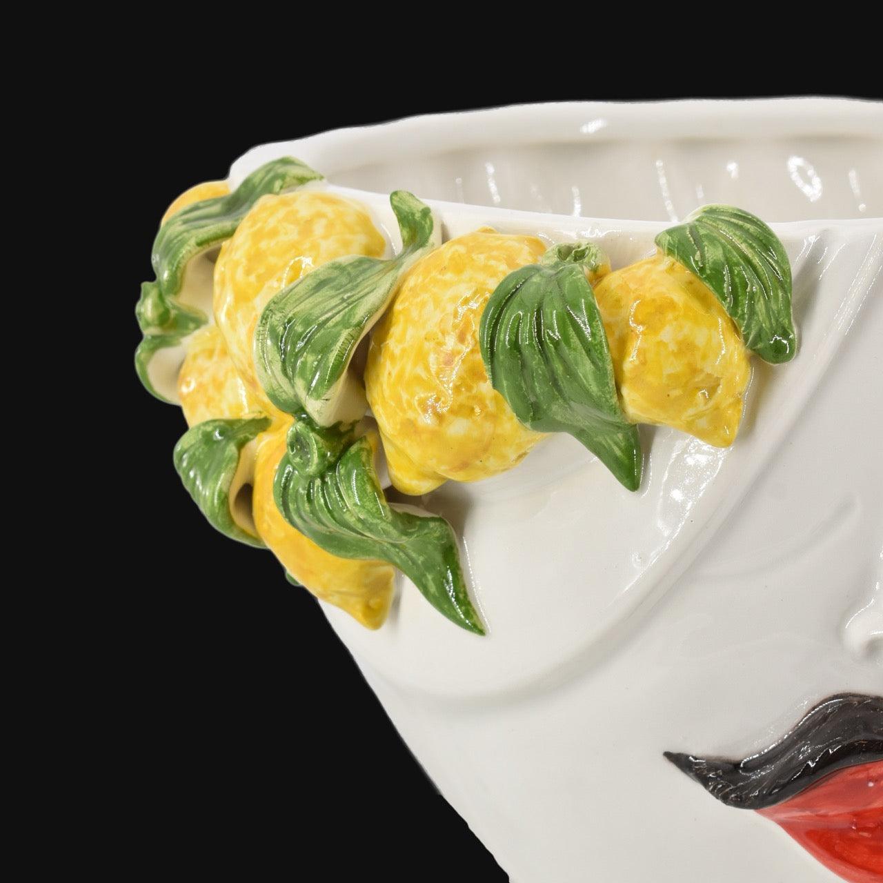 Handcrafted Teste di Moro ceramic with vibrant yellow lemons and green leaves, blending tradition and modern design.