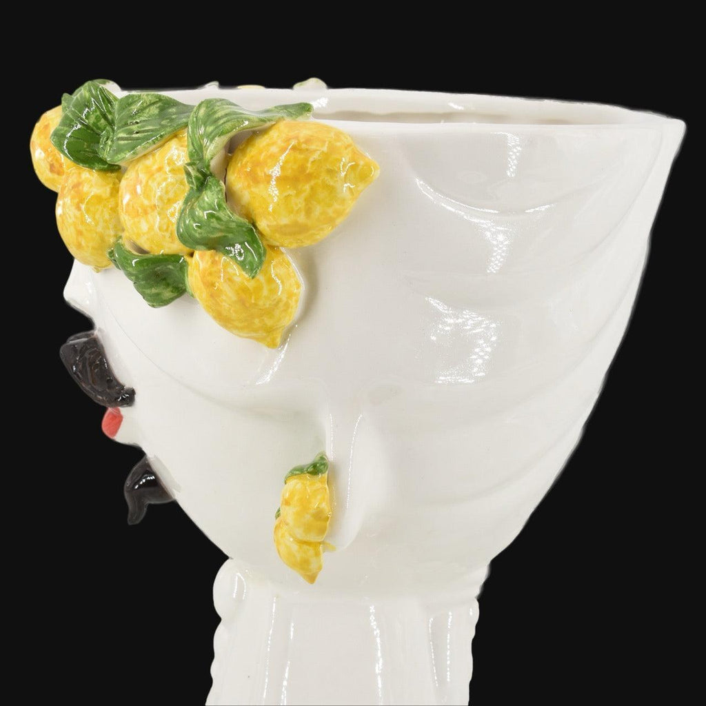 Handcrafted Teste di Moro vase with vibrant lemons and green leaves, blending Sicilian tradition with modern design.