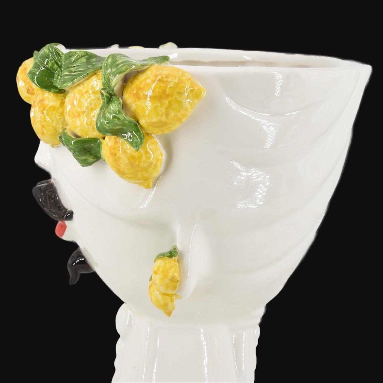 Handcrafted Teste di Moro vase with vibrant lemons and green leaves, blending Sicilian tradition with modern design.