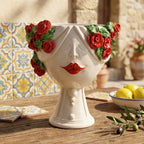 Handmade Teste di Moro planter with red roses, ceramic face, and vibrant Sicilian tiles