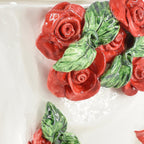 Handcrafted ceramic roses with green leaves, glossy finish, decorative wall art