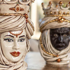 Handcrafted Teste di Moro ceramic statues with ornate crowns and gold accents, blending tradition and modern design.