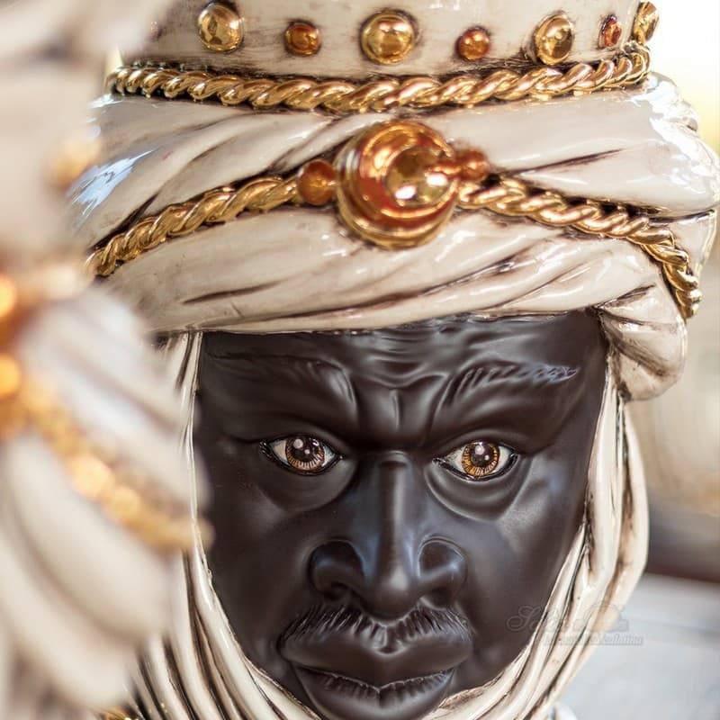 Handcrafted Teste di Moro ceramic bust with ornate white turban and gold accents, blending tradition and modern design.