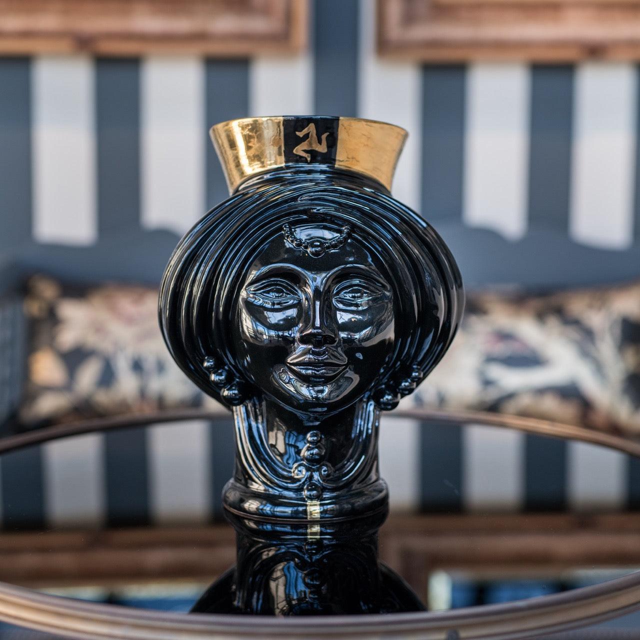 Handcrafted black Teste di Moro vase with gold rim, blending Sicilian tradition and modern design for home decor.