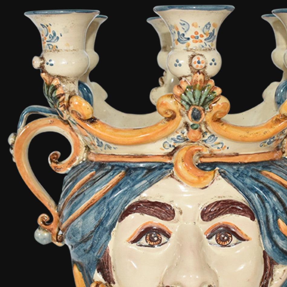 Handcrafted Teste di Moro candelabra with vibrant blue hair and ornate floral details