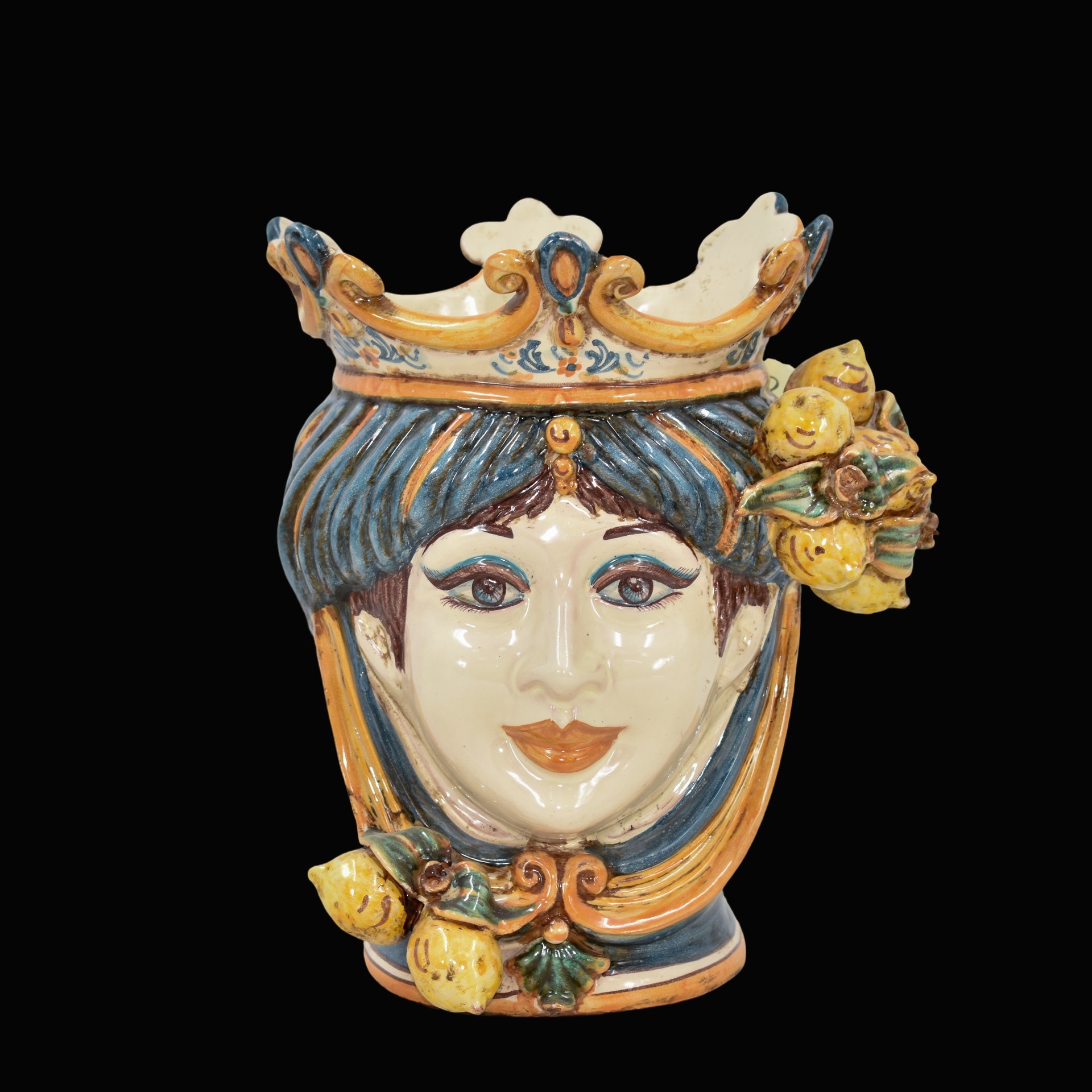 Handmade Sicilian Testa di Moro vase with crown, lemons, and blue hair, blending tradition and modern design.