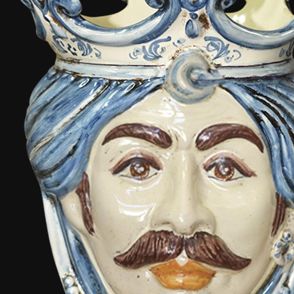 Handcrafted Teste di Moro ceramic face with blue turban and crown, traditional Sicilian design