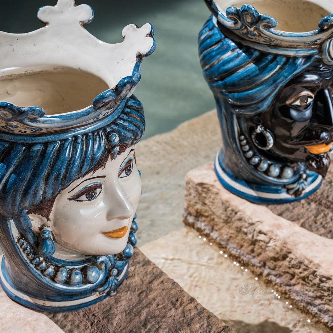 Handmade Teste di Moro ceramic vases with blue and white glaze, featuring detailed facial designs and crowns.